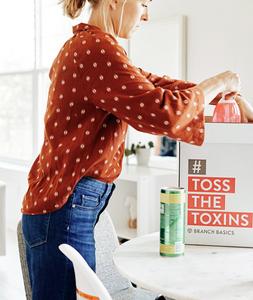 Founder Allison Evans tossing toxic cleaners